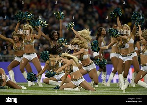 The Jacksonville Jaguars cheerleaders perform during the NFL International match at Wembley Stadium, London. Picture date: Sunday November 9, 2014. See PA story GRIDIRON NFL. Photo credit should read: Andrew Matthews/PA Wire. RESTRICTIONS: News and Commercial/Non-Editorial use requires prior written permission from the NFL. Digital use subject to reasonable number restriction and no video simulation of game. For further info please call 44 (0)115 8447447 Stock Photo - Alamy