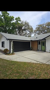 Loved the way this turned out! We installed black Gutters and Gutter Guard to accent the black trim colors on this cutomers beautiful home in Apopka 💚🤍🖤 #gutters #apopka | Well Hung LLC
