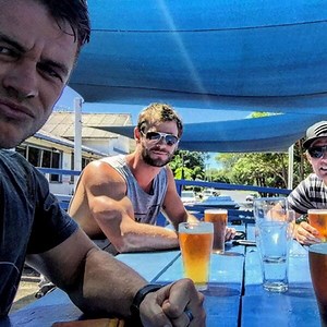 Chris Hemsworth Attributes His Bulging Biceps to "Photoshop, Lighting and Certain Angles"
