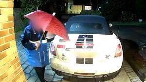 Shocking moment mystery woman stuffs 'manure' through letterbox of elderly couple and smears paint stripper over their cars