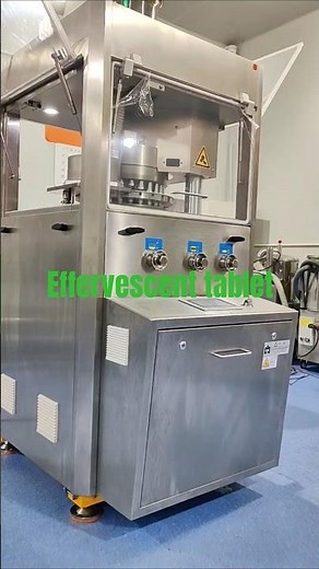 Effervescent tablet press and tablet de-duster