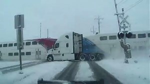 Watch: Railroad crossing gates still 'up' before train careens into passing 18-wheeler