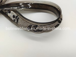 [Hot Item] 25mm Transparency Grey PVC Webbing with Silver Crystal OEM Dome Studs Coated PVC Webbing for Shoes Factory Supply Shoe Coated PVC Webbing Accessories