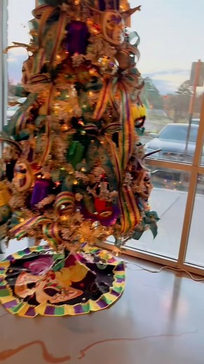 The lighting wasn’t so great and I’m not a good photographer AT ALL because THIS TREE IS GORGEOUS IN PERSON!!!!!! Bling Bling Mardi Gras tree for Georgia Blue, Madison, MS Go check it out if you’re in the area !! Tag me when you take a photo with it 💚💜💛 | Floral Creations by Kristina