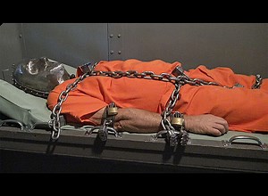 Shackled down in a metal head cage @ ManSurfer