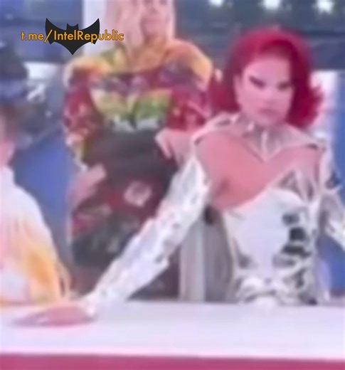 ⚠️ WARNING: DISTURBING CONTENT 🇫🇷🌈 PEDOPHILIA OPENLY PROMOTED AT PARIS OLYMPICS? Extremely troubling detail emerges pointing at same opening ceremony performer whispering to little girl (right top, middle) shoved in blasphemous Last Supper recreation, reportedly had his testicles dangling shamelessly too close to child and for world to see (left pic). Contrast between France's abomination and Russia's elegant opening ceremony in Sochi 2014 (bottom right) is why West's degenerates fiercely des