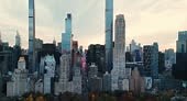 Drone flies above the Central Park revealing the view of the...
