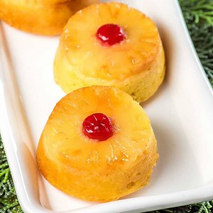 31K views · 136 reactions | Mini Pineapple Upside Down Rum Cakes! Mini spongy yellow cakes topped with sweet pineapple and maraschino cherries that are generously brushed with Don Q Piña (pineapple rum). #ad #Exceptional #DonQRum Don Q GET THE RECIPE: https://homemadehooplah.com/mini-pineapple-upside-rum-cakes/ | Homemade Hooplah | Facebook