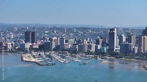 The South African port city of Durban and inner city in background, aerial view. Durban's yacht club in foreground.