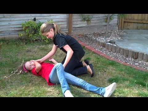 Child putting a child in the recovery position