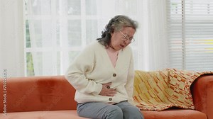 Asian Elderly senior woman stomach ache so pain illness,food poisoning in patient have a bacteria infection,Unhappy elderly painful on stomach vomit and tried need medicine and rest,Elderly Health