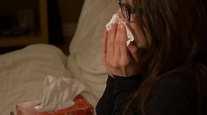 clip-12724982-slow-motion-woman-blowing-nose-into-tissue