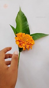 400K views · 2.3K reactions | Check out this easy DIY flower decoration using mango leaves and marigold flowers! A perfect touch for any celebration or home decor.  #FlowerDecoration #Marigold #DIYFlowers #HomeDecor | Made by Kaushika | Facebook