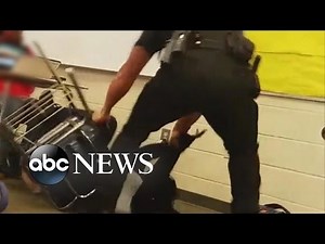 Police Officer Appears to Manhandle Student