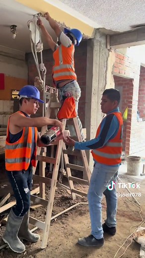 Construction Workers in Action at Building Site