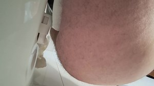 Making a puddle in the public toilets