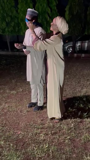 Traditional Attire Couple: Nighttime Embrace