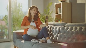 Pregnant Woman Video Chats at Home
