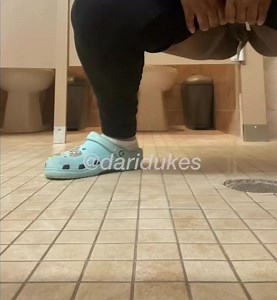 Ebony squat pees over floor drain