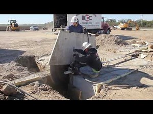 Concrete wall saw cuts horizontal surface at construction job site