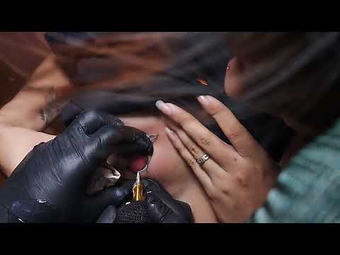 girl's chest tattoo (cherry) 🍒 art done by InkMore Tattoo