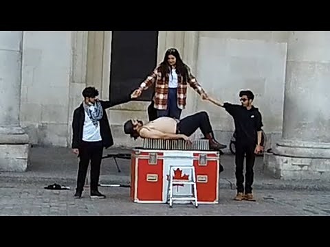 Street Performer | sitting on a bed of nails | London
