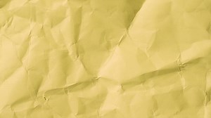 Yellow Crumpled paper texture crumpled sheet stop motion seamless loop