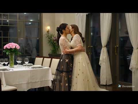 Asians lesbians embracing passionately in a romantic restaurant first date