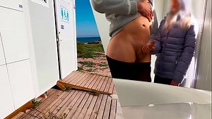 I surprise a girl who catches me jerking off in a public bathroom on the beach and helps me finish cumming