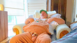 Bib overalls on farmer grandpa with wide feet has hands-free across the room