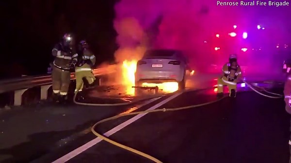 Shocking moment Tesla is engulfed by flames on a busy highway