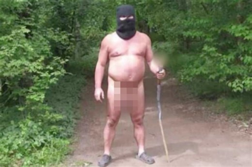Naked man wearing only balaclava and plastic clogs — and carrying sex toy on a stick — terrifies European tourists
