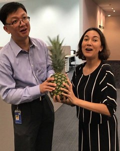 Huat ah! SPH Magazines CEO Loh Yew Seng and Senior Features Writer Natalya Molok do the pineapple jam to usher in good tidings and prosperity as we open our doors to our new Toa Payoh office. | The Singapore Women's Weekly | Facebook