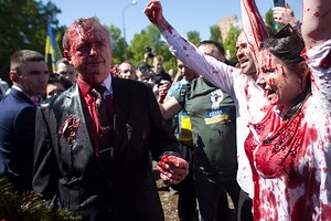 Russian ambassador to Poland hit with red paint by protesters