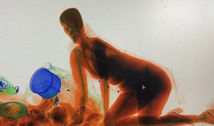 Viral video: Chinese woman crawls into X-ray machine to protect her handbag, watch
