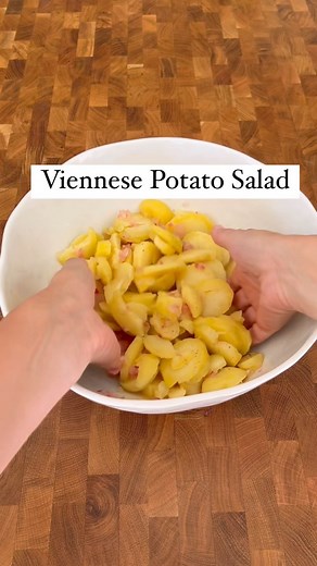 Astrid Lamarche on Instagram: "Potato salad the Austrian way. That’s what you want to eat with your Schnitzel. You want to use potatoes that don’t fall apart when you boil them. Less starch = holds up better. Usually Gold Potatoes work ok in the US, you’ll get best results with Baby Dutch potatoes. … and no mayonnaise in this potato salad! You’ll find this style of potato salad all over Austria in restaurants (Gasthaus) and Heuriger - eateries in the wine regions. It goes with many hot and cold