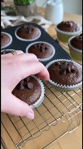 Healthy Chocolate Zucchini Muffins Ingredients Makes 12 Muffins 1 cup grated zucchini (squeezed of as much moisture as possible) 3 over ripe bananas (very spotty or completely brown.) 1/4 cup unsalted butter (melted) 1/2 cup greek yogurt 1/2 cup milk 2 eggs 1/2 cup maple syrup 1 teaspoon vanilla 1 and 1/2 cups white whole wheat flour 1/2 cup unsweetened cocoa powder 1 tsp baking powder 1/2 cup chocolate chips (1/4 cup for topping. Mini or regular sized will work.) 2 tsp cinnamon 1 tsp baking sod