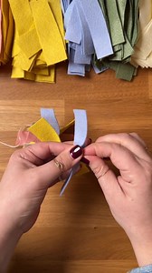 Have you wondered what to do with your pretty felt scraps? Make a pretty garland like this one! You can use any shape of felt and it this demo you can see how simple strips can turn into something beautiful. https://liagriffith.com/felt-scraps-garland/ | Lia Griffith - Handcraft Your Life