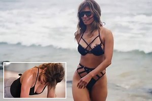 Halle Berry sizzles in black bikini on the beach as she shares workout video