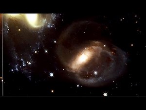 The Galactic Group Stephan's Quintet: Zooming Out | Hubble FriendsofNASA.org: In this zoom sequence Hubble's Wide Field Camera 3 focuses its attention on a group of five galaxies known as Stephan's Quintet. Three of the galaxies are interacting, while one of the galaxies actually lies about seven times closer to Earth than the rest of the group. The wide range of colors in the image depicts the varying ages of the stars. Distance: 300 million light years The video also highlights the imaging cap