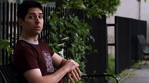 Young Adult Male Sits On Bench: vídeo stock (100% livre de direitos) 4658429 | Shutterstock