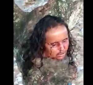 The gang cut off the woman's head and put it on a tree - XGore - Extreme Gore Videos
