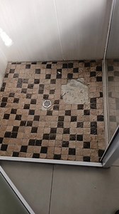 This shower floor was done incorrectly and unprofessionally. We are about to fix it. Location: Sunningdale, Cape Town #capetilingprojects #tilercapetown #homeimprovement | Cape Tiling Projects