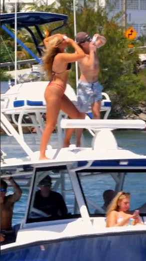Boats, beer, and bikinis. Tilting a couple back spring break style | Boca Inlet #bikini #fun #party