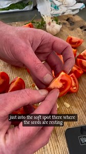 We love this little tomato-tip from Gill Meller - and it's just as useful when roasting your tomatoes in the oven, as it is for barbecuing them. Tossing garlic in with roasting tomatoes can result in burned garlic, if you get your timing wrong. But Gill's trick of tucking the sliced garlic cloves into the fleshy part of the tomato means that the flavour permeates, and flavours beautifully, with no risk of that bitter burnt taste. Halve, or quarter your tomatoes, slice your garlic cloves, and tuc