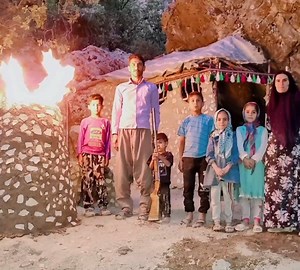 Making torches outside the house for lighting by nomadic women and men in (Iran) | Outdoor Cooking