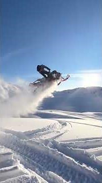 Snowmobile acrobatics in the backlands