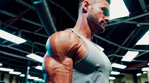 Bodybuilder Performing Intense Workout Scene in Gym Footage