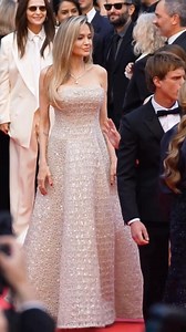 Hollywood icon Angelina Jolie made a breathtaking appearance at the Cannes Film Festival, stepping onto the red carpet in a glittering nude gown by Brunello Cucinelli, beautifully adorned with delicate embellishments. Her look was completed with dazzling diamond jewelry, and soft blonde waves parted to the side — pure elegance. This year, Jolie takes on a new role as the Godmother of the Trophée Chopard Award, presenting the prestigious prize to rising stars Marie Colomb and Finn Bennett. She po