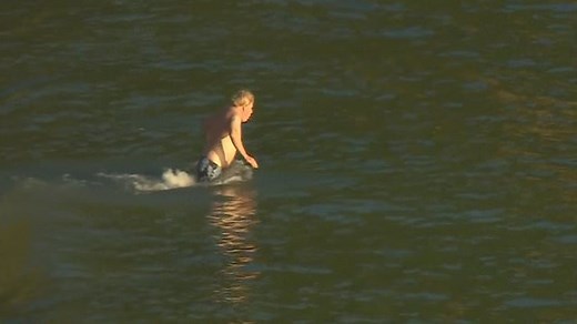 Boris Johnson runs into the sea to take a swim in Cornwall's Carbis Bay